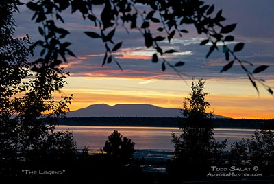 The Sleeping Lady (Mt. Susitna) lies on the western horizon as viewed from Bootleggers Cover in downtown Anchorage, Alaska during a late summer sunset.